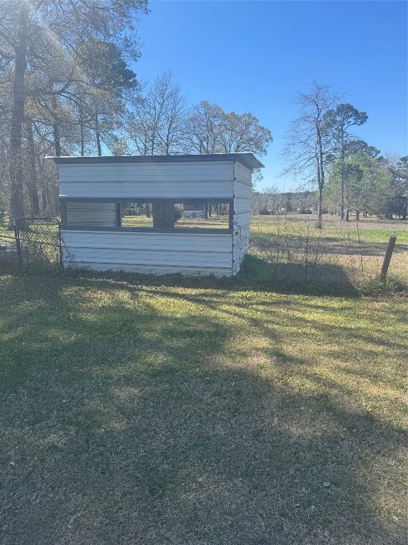 15698 Plaster Circle Conroe, TX 77303 - Photo 2 of 14 a view of a big yard with an outdoor space