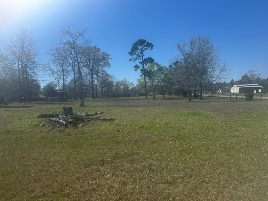 15698 Plaster Circle Conroe, TX 77303 - Photo 4 of 14 a view of a lake with houses in the background