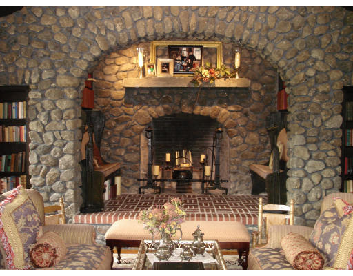 48 Stafford Road Hampden, MA 01036 - Photo 5 of 7 a living room with a fireplace a dining table and a fireplace