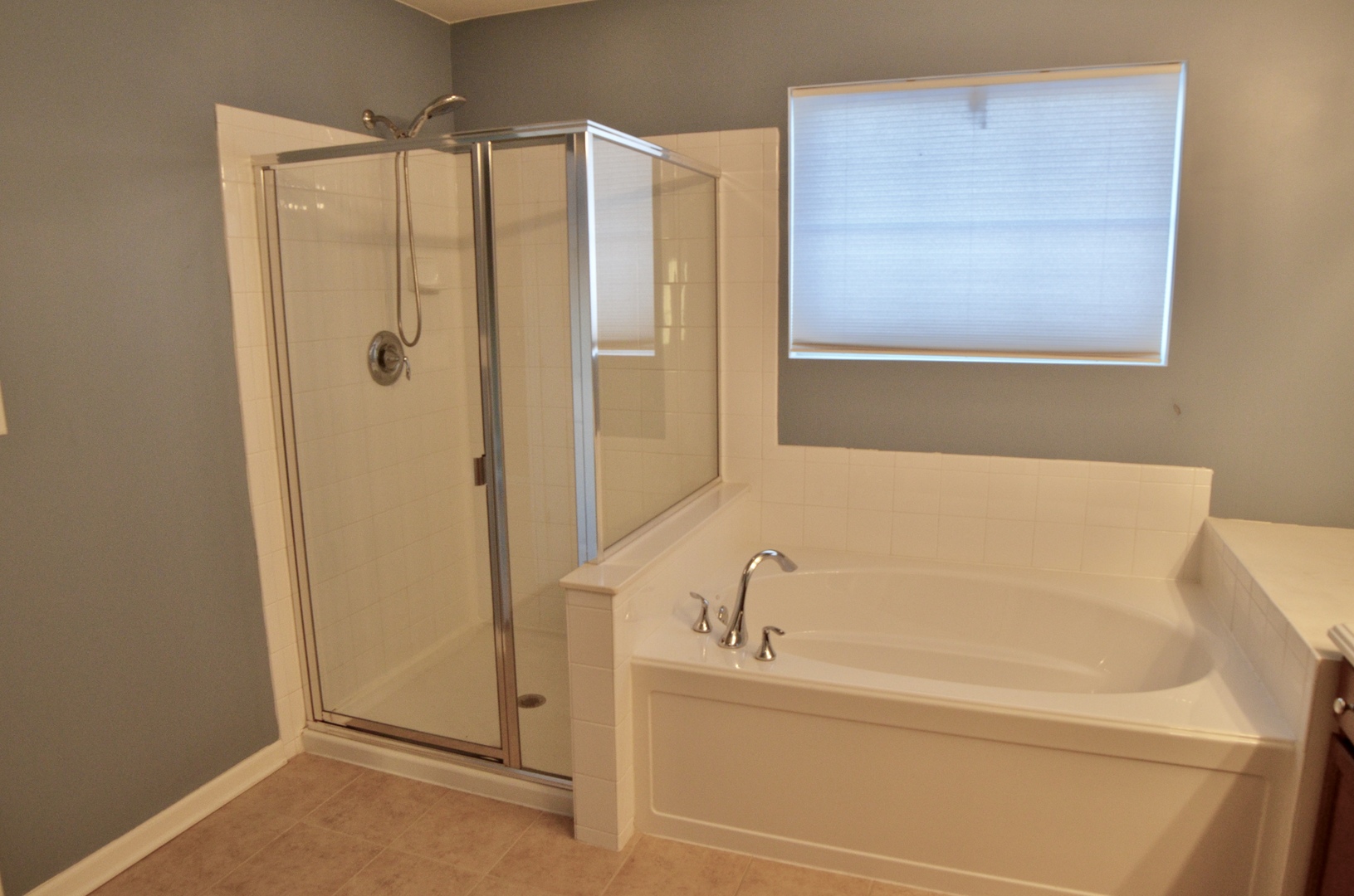423 Azalea Street Elgin, IL 60124 - Photo 15 of 21 a bathroom with a tub and shower
