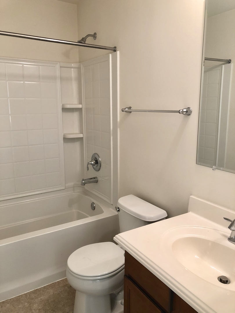 423 Azalea Street Elgin, IL 60124 - Photo 16 of 21 a bathroom with a sink and toilet