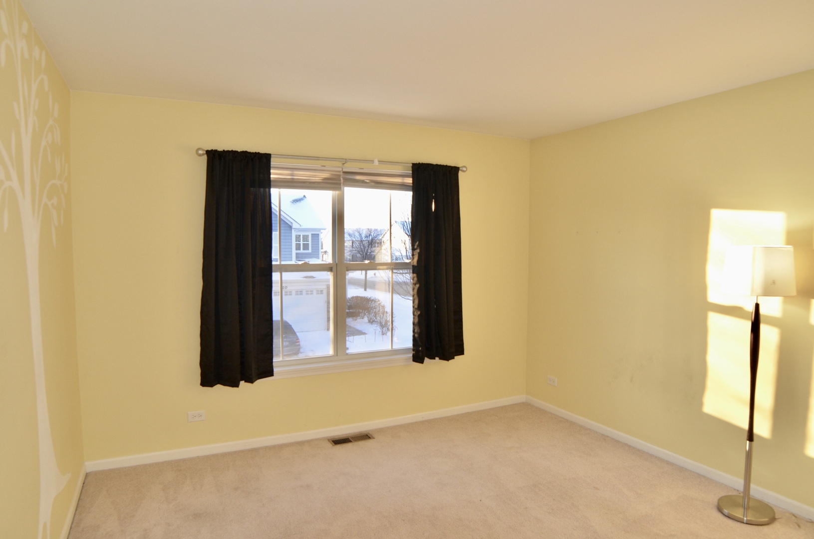 423 Azalea Street Elgin, IL 60124 - Photo 17 of 21 a view of an empty room with a window