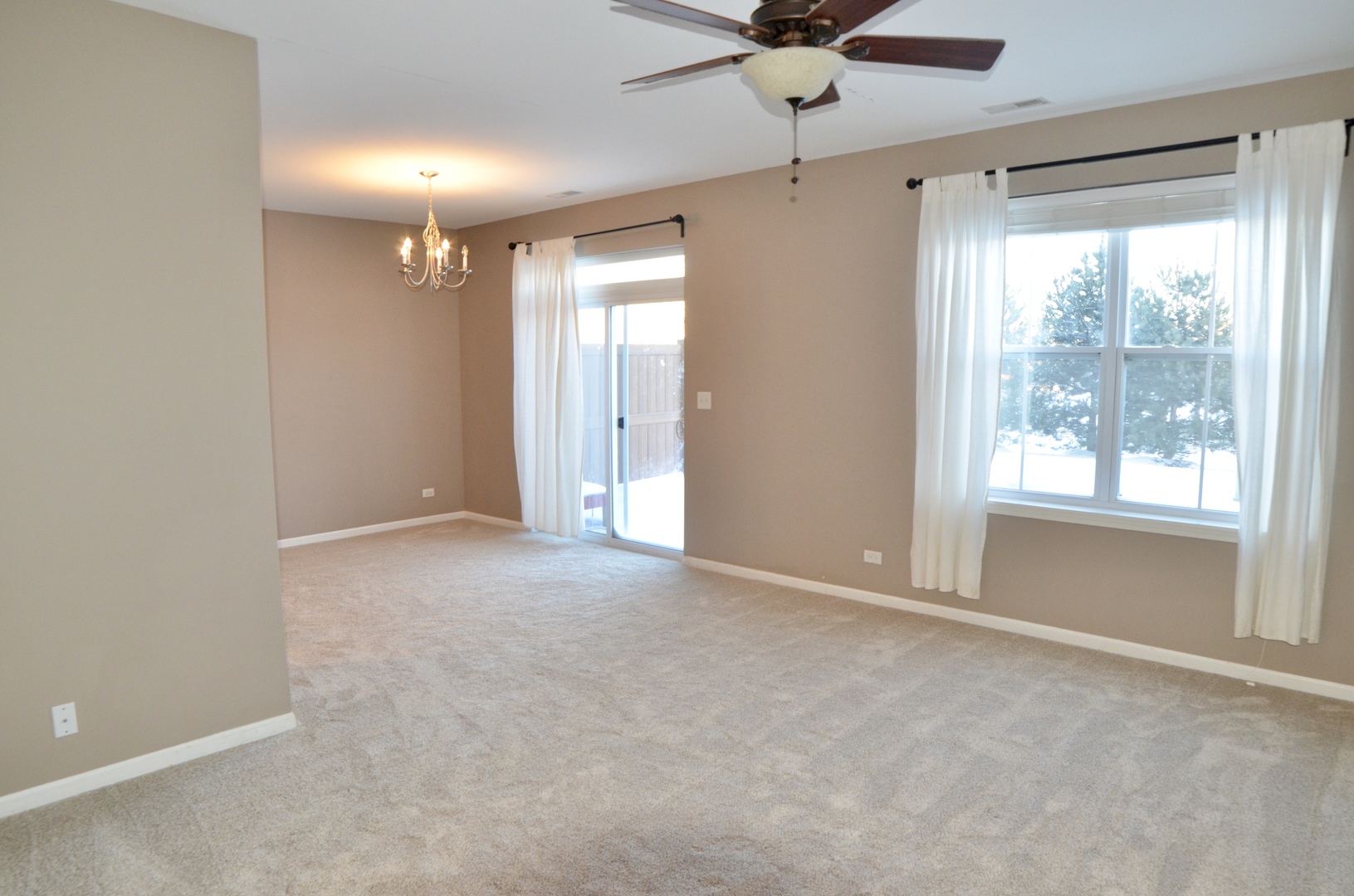 423 Azalea Street Elgin, IL 60124 - Photo 3 of 21 a view of an empty room with a window
