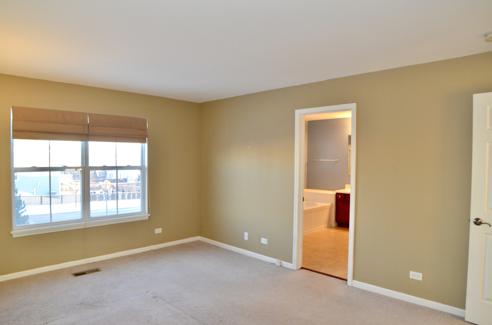 423 Azalea Street Elgin, IL 60124 - Photo 8 of 21 a view of an empty room with a window