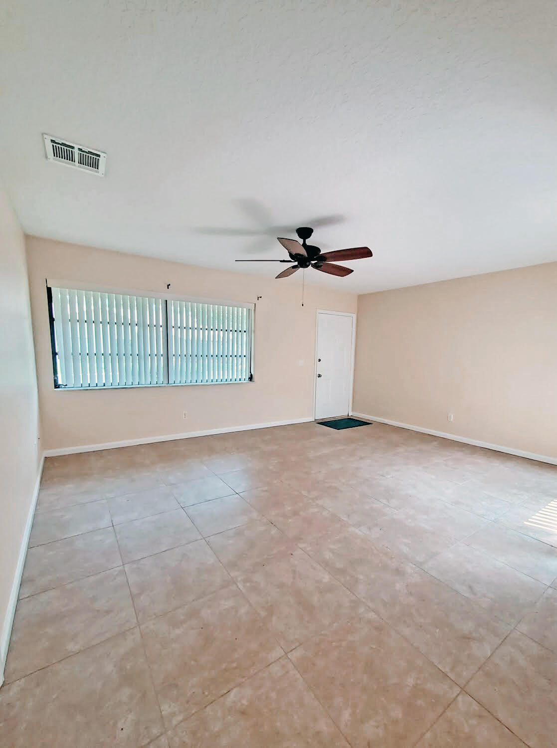 2821 Stoneway Lane, Unit A Fort Pierce, FL 34982 - Photo 1 of 14 an empty room with windows