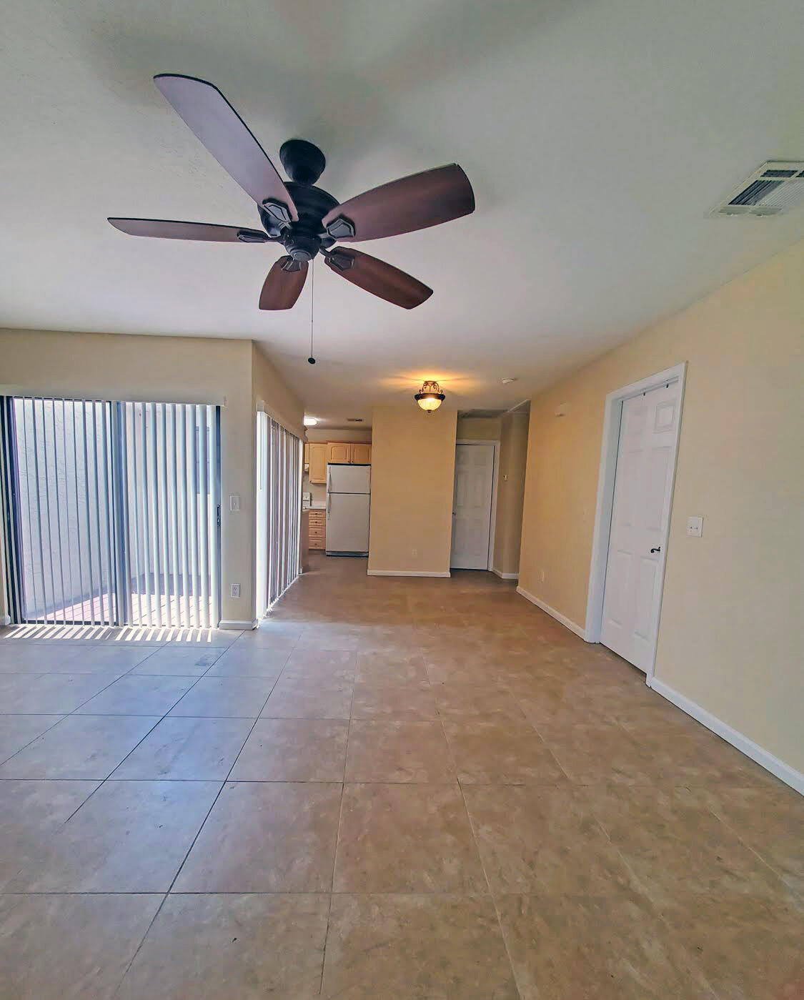 2821 Stoneway Lane, Unit A Fort Pierce, FL 34982 - Photo 2 of 14 a view of a livingroom with a ceiling fan and window