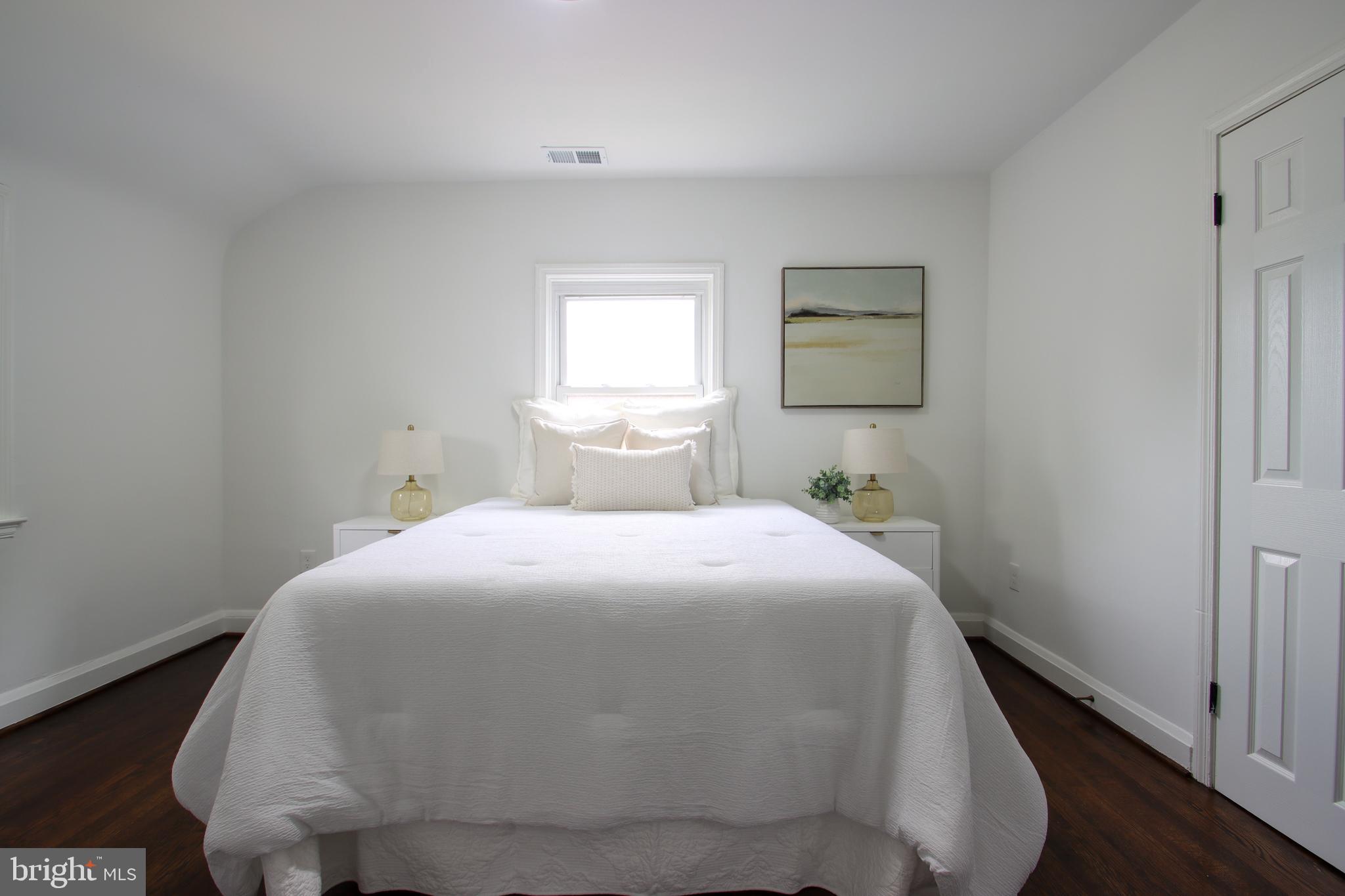 4501 Rokeby Road Baltimore, MD 21229 - Photo 13 of 26 a bedroom with a bed and window