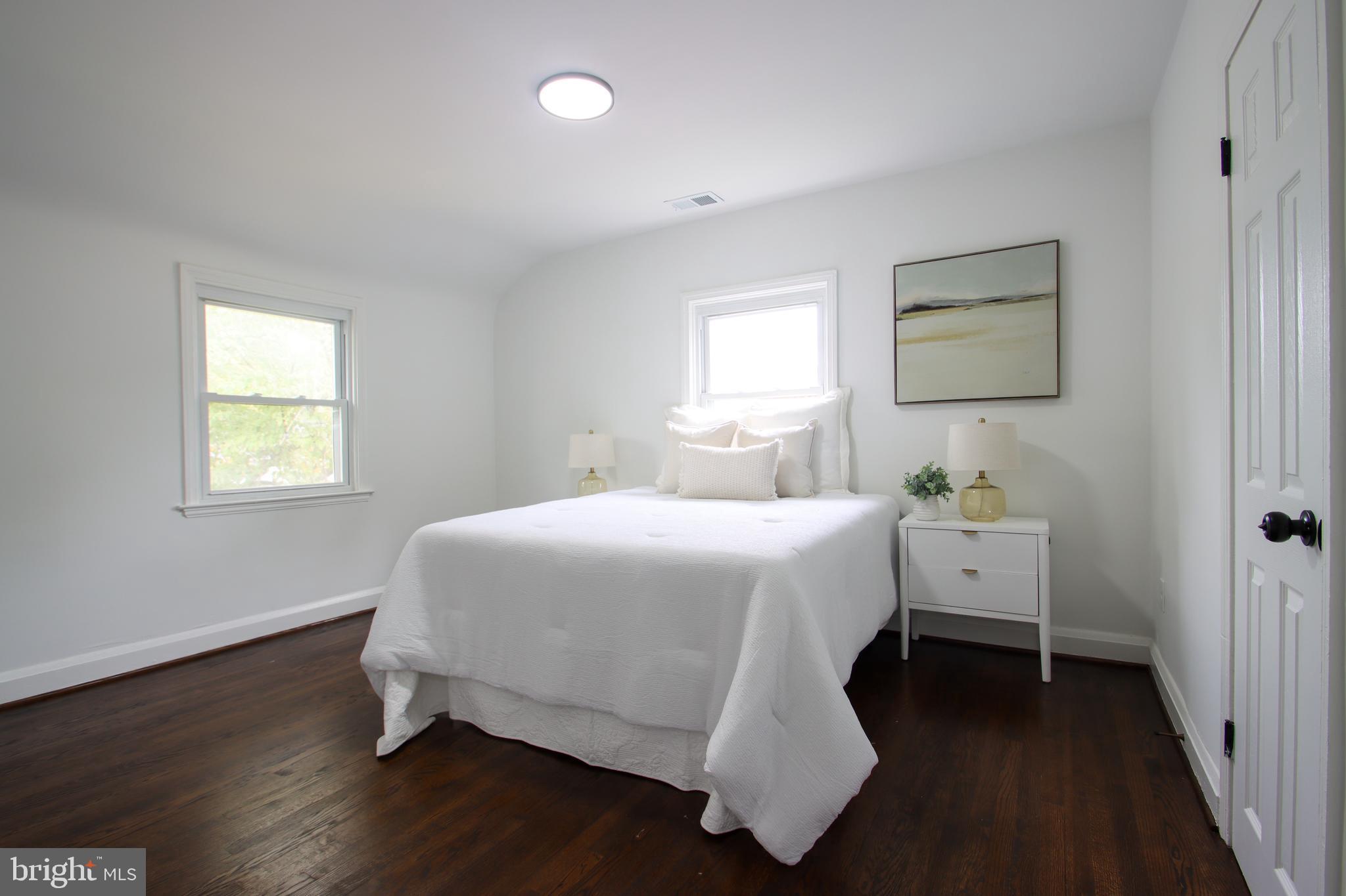 4501 Rokeby Road Baltimore, MD 21229 - Photo 14 of 26 a bedroom with a bed and a window