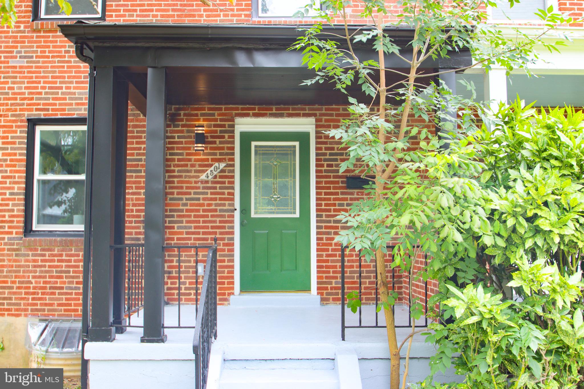 4501 Rokeby Road Baltimore, MD 21229 - Photo 2 of 26 a front view of a house with a garden