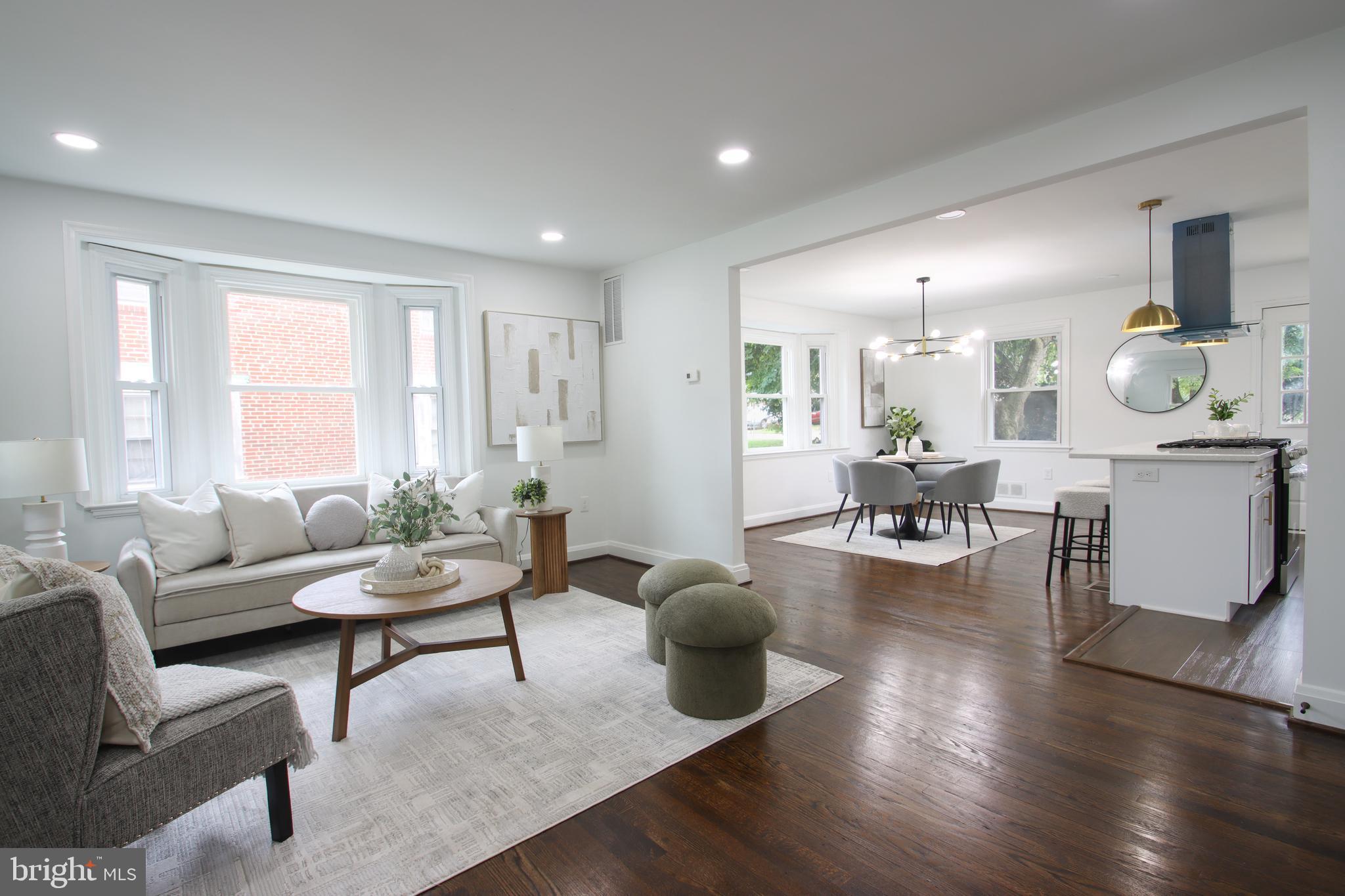 4501 Rokeby Road Baltimore, MD 21229 - Photo 6 of 26 a living room with furniture and wooden floor
