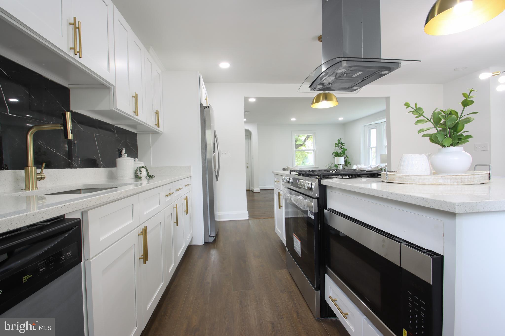 4501 Rokeby Road Baltimore, MD 21229 - Photo 7 of 26 a large kitchen with a stove and a sink