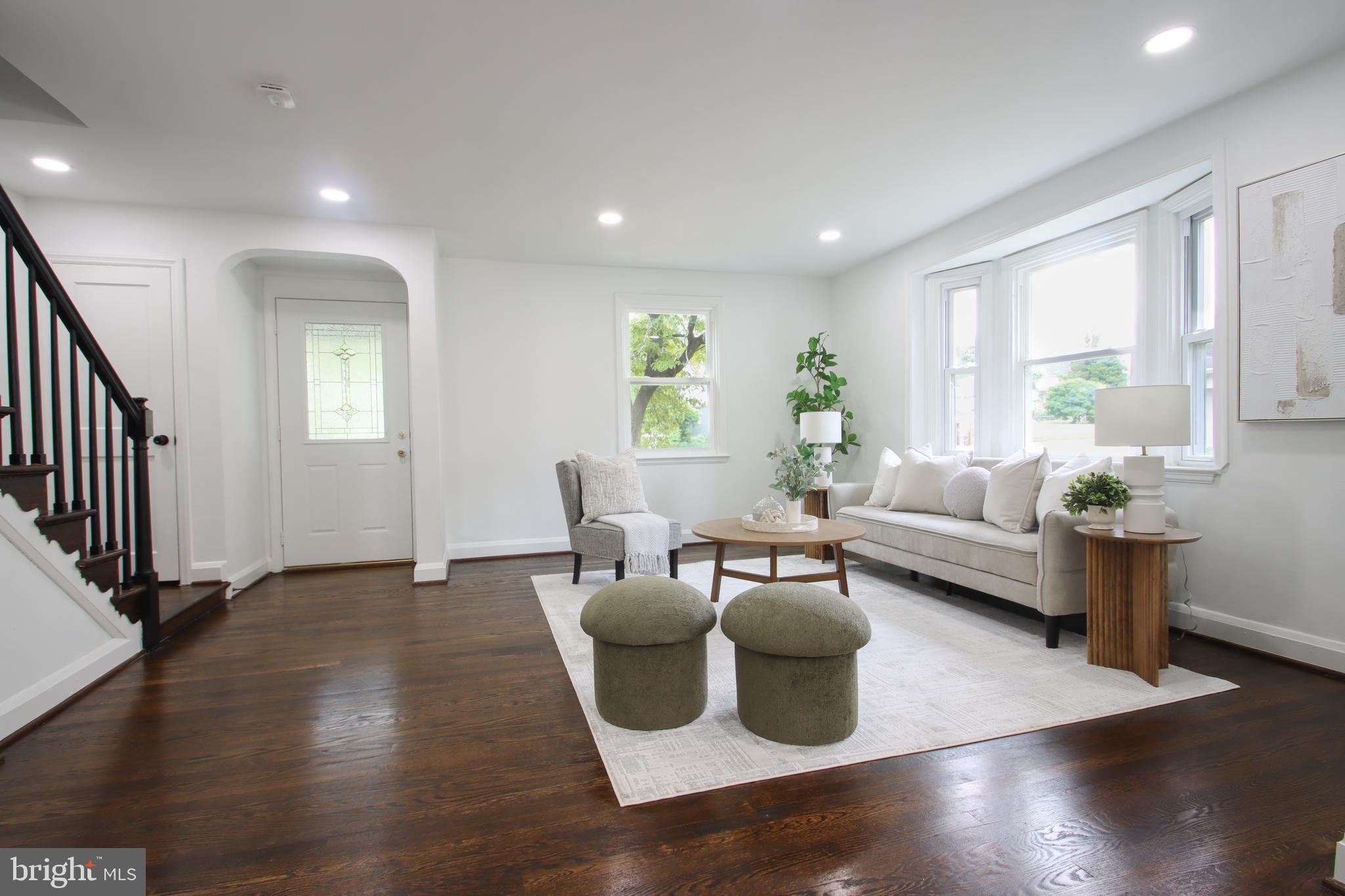 4501 Rokeby Road Baltimore, MD 21229 - Photo 9 of 26 a living room with furniture and a wooden floor