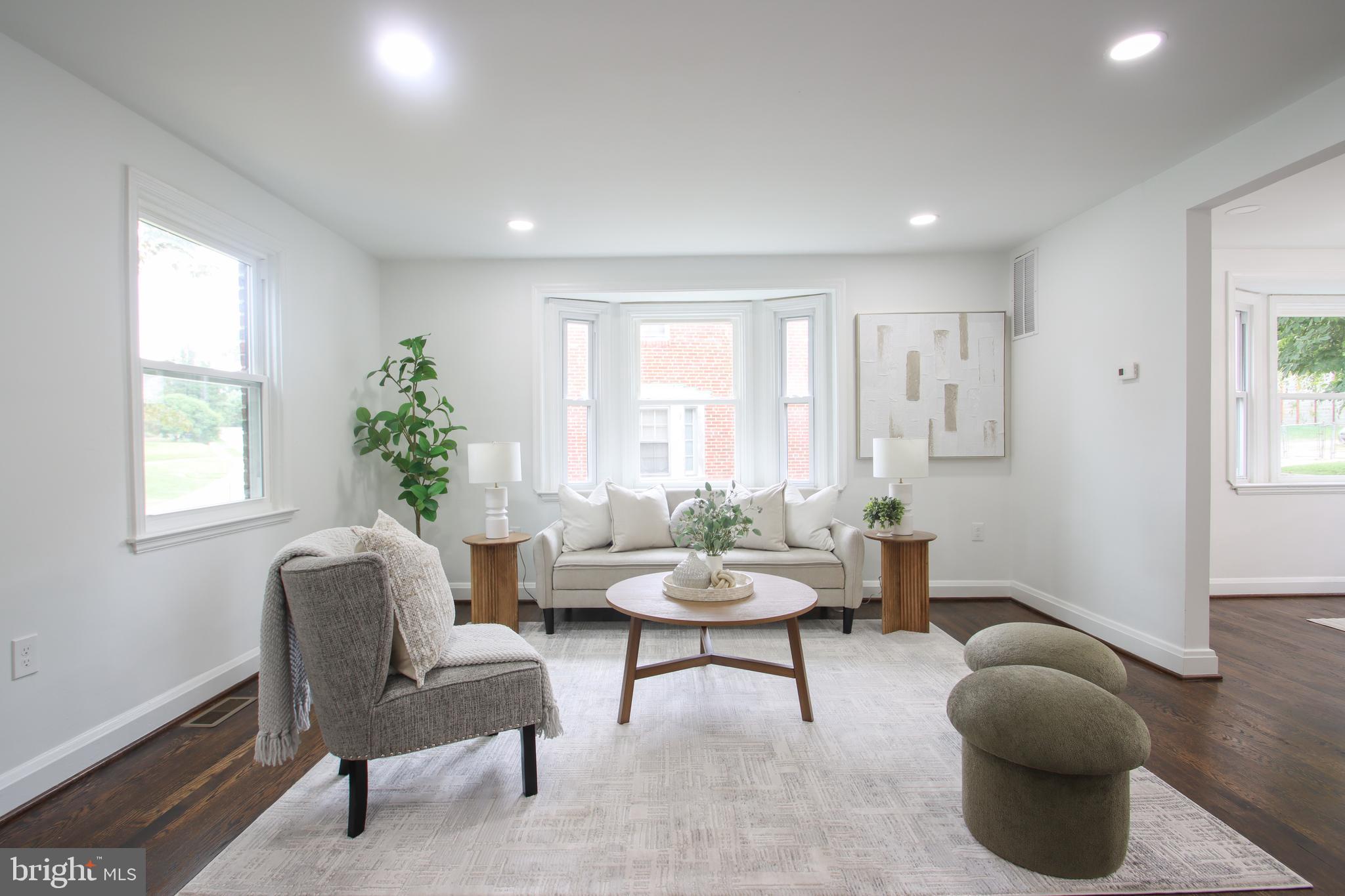 4501 Rokeby Road Baltimore, MD 21229 - Photo 10 of 26 a living room with furniture and a potted plant
