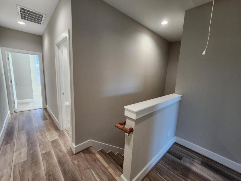 3206 Bostic Street Houston, TX 77093 - Photo 14 of 28 a view of a hallway with wooden floor