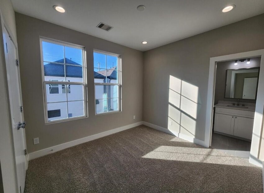 3206 Bostic Street Houston, TX 77093 - Photo 16 of 28 a view of an empty room with a window and wooden floor