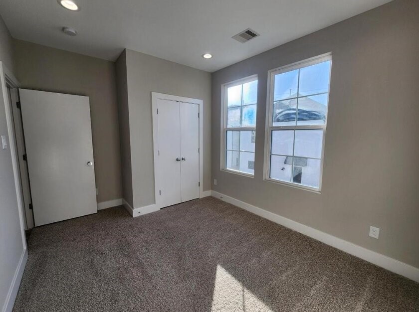 3206 Bostic Street Houston, TX 77093 - Photo 17 of 28 an empty room with windows and closet