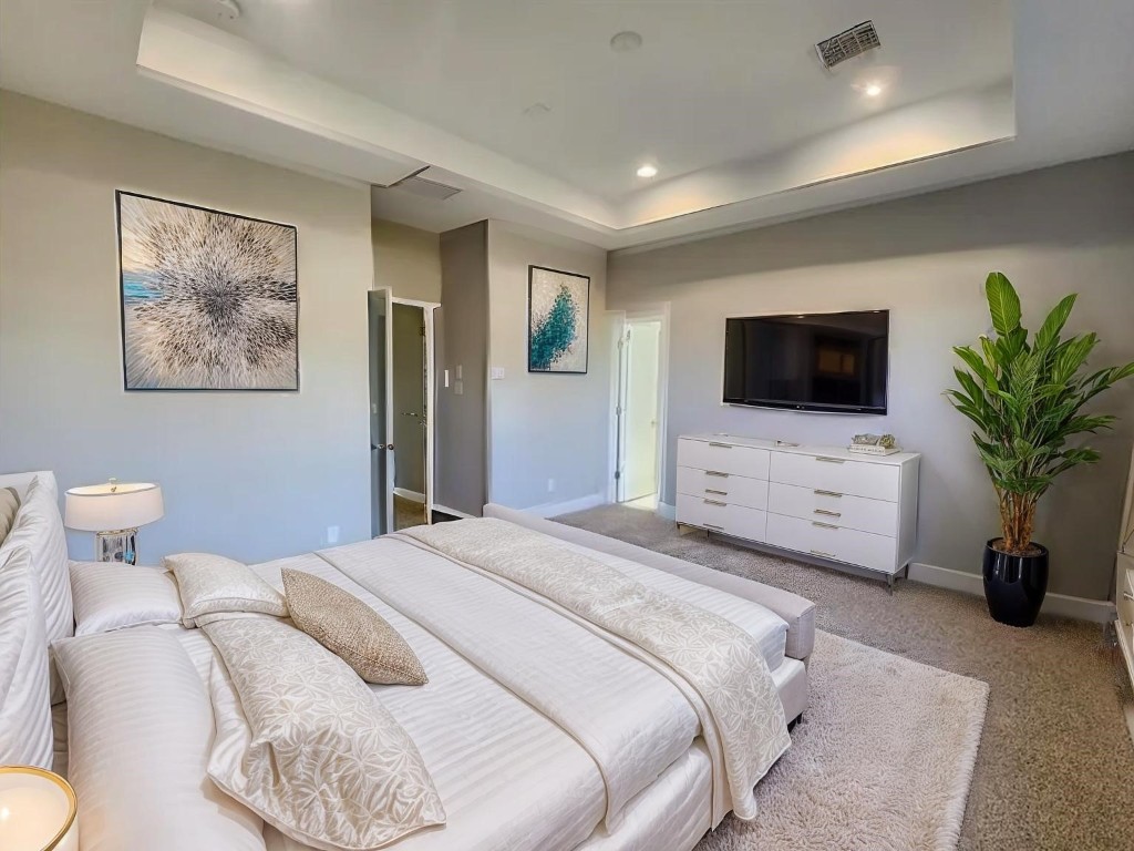 3206 Bostic Street Houston, TX 77093 - Photo 20 of 28 a bedroom with a bed and a flat screen tv