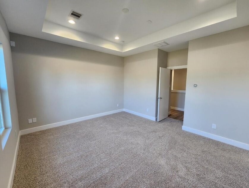 3206 Bostic Street Houston, TX 77093 - Photo 22 of 28 an empty room with windows and refrigerator