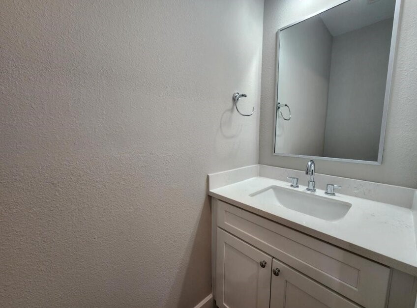 3206 Bostic Street Houston, TX 77093 - Photo 23 of 28 a bathroom with a sink and a mirror
