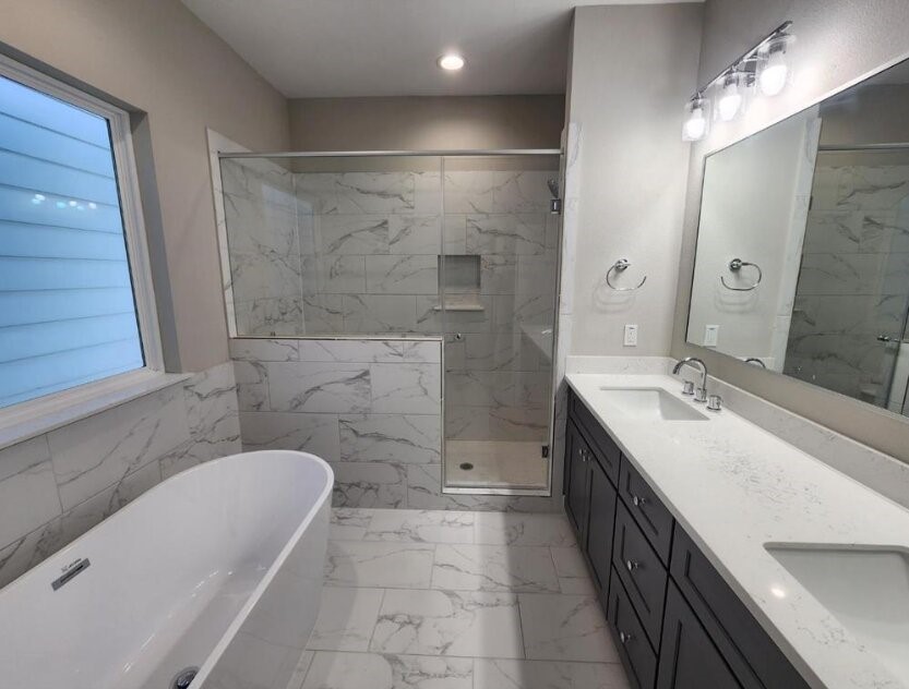 3206 Bostic Street Houston, TX 77093 - Photo 26 of 28 a bathroom with a tub sink and mirror
