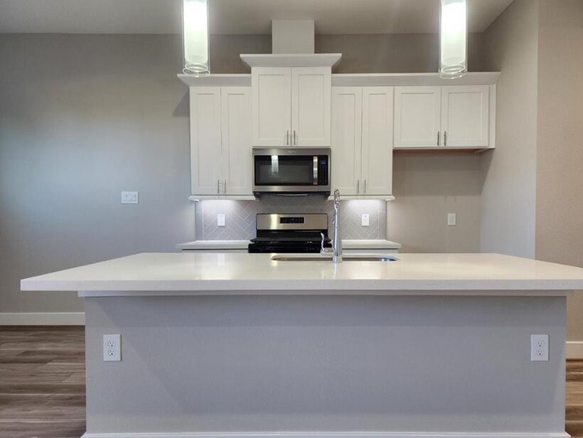 3206 Bostic Street Houston, TX 77093 - Photo 9 of 28 a kitchen with a stove and a white cabinets