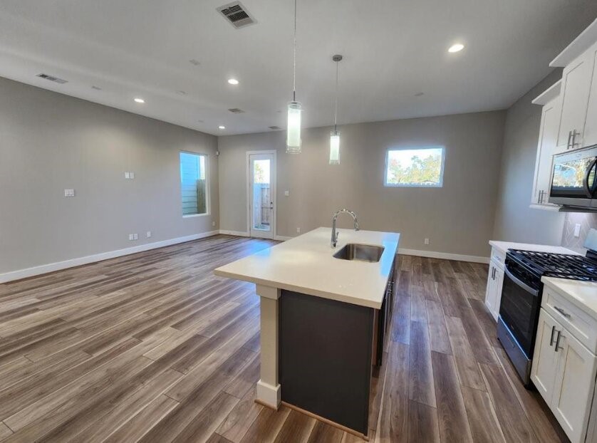 3206 Bostic Street Houston, TX 77093 - Photo 10 of 28 a view of a kitchen counter space with wooden floor