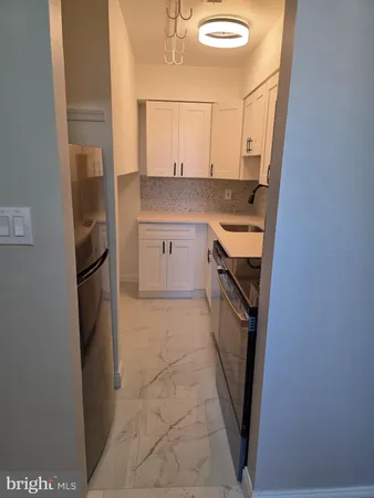 a kitchen with a sink a washer and dryer