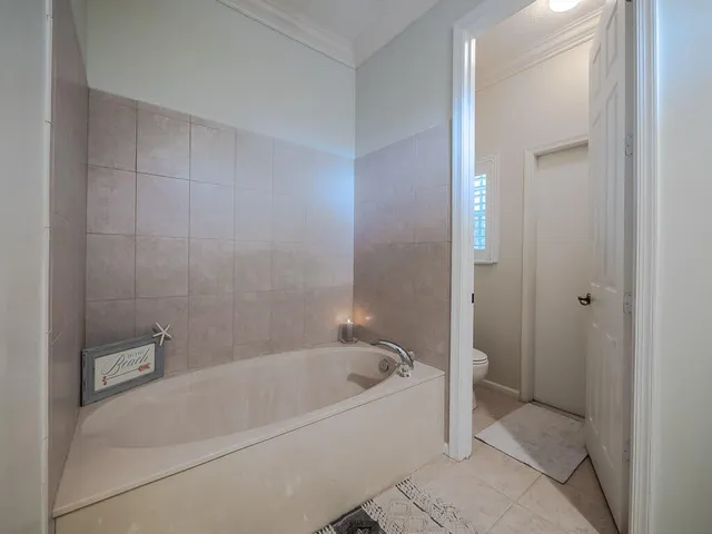 a white bath tub sitting in a bathroom