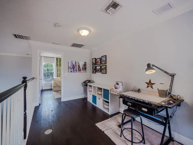 a workspace with furniture and wooden floor