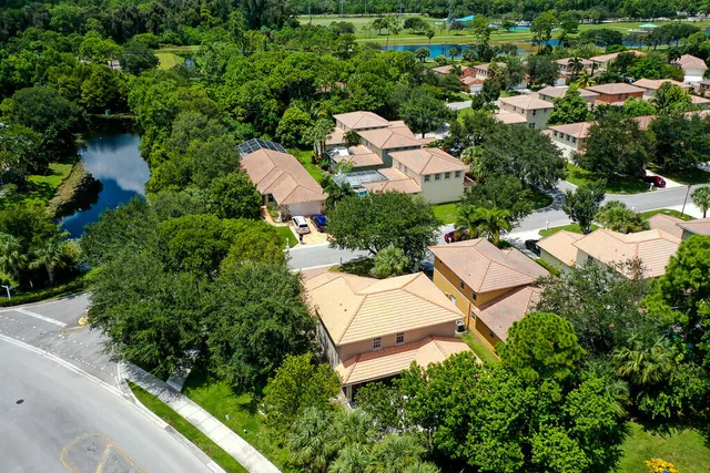 an aerial view of a house with a yard