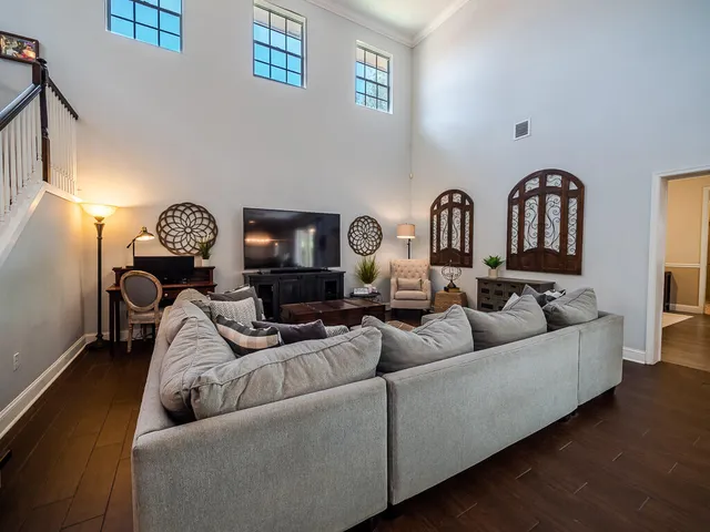 a living room with furniture and a fireplace