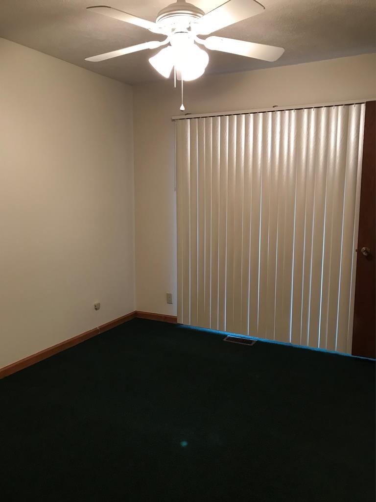 339 Bluegill Road Eatonton, GA 31024 - Photo 12 of 20 a view of a livingroom with a fan wooden floor and a fan