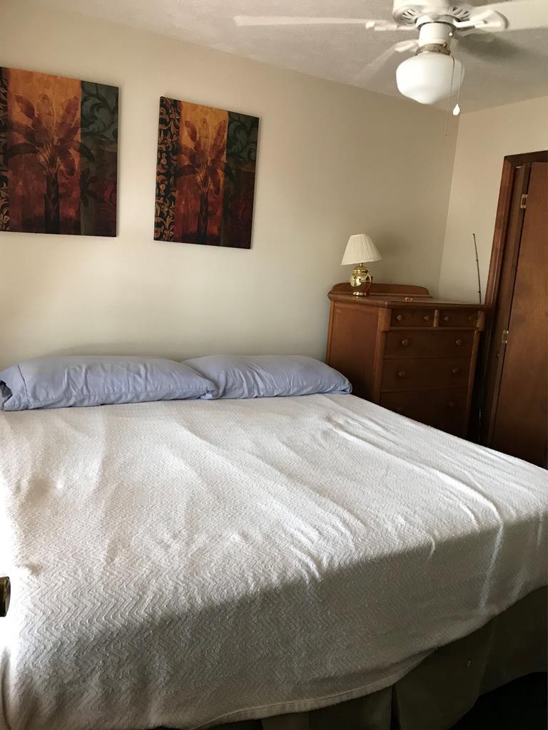 339 Bluegill Road Eatonton, GA 31024 - Photo 17 of 20 a bedroom with a bed and painting on the wall