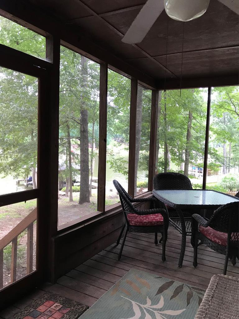 339 Bluegill Road Eatonton, GA 31024 - Photo 5 of 20 a view of a porch with furniture and a yard