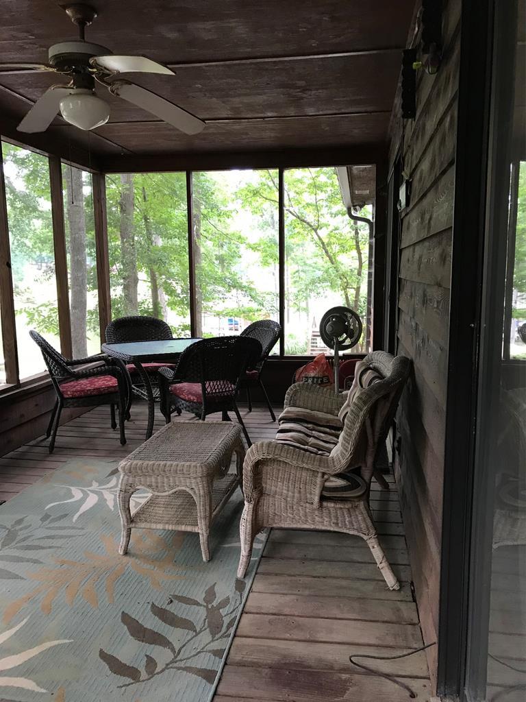 339 Bluegill Road Eatonton, GA 31024 - Photo 6 of 20 a living room with furniture and large windows