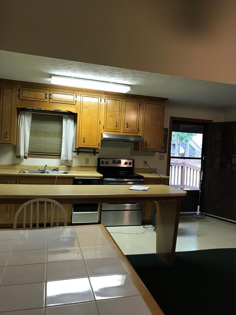339 Bluegill Road Eatonton, GA 31024 - Photo 7 of 20 a kitchen with a sink cabinets and window