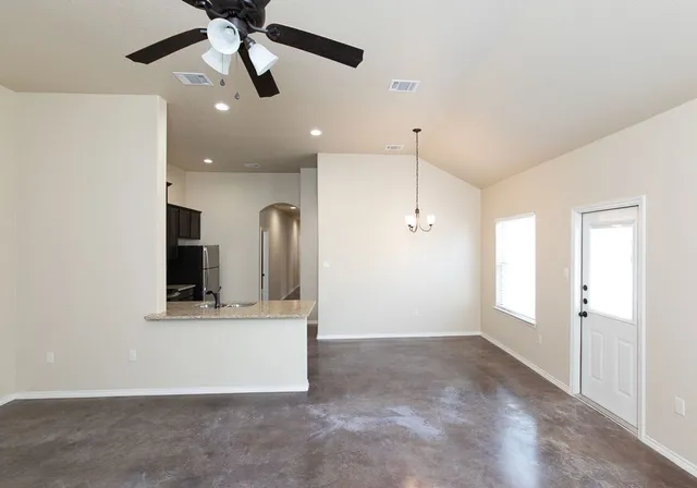 a view of a hallway with a kitchen