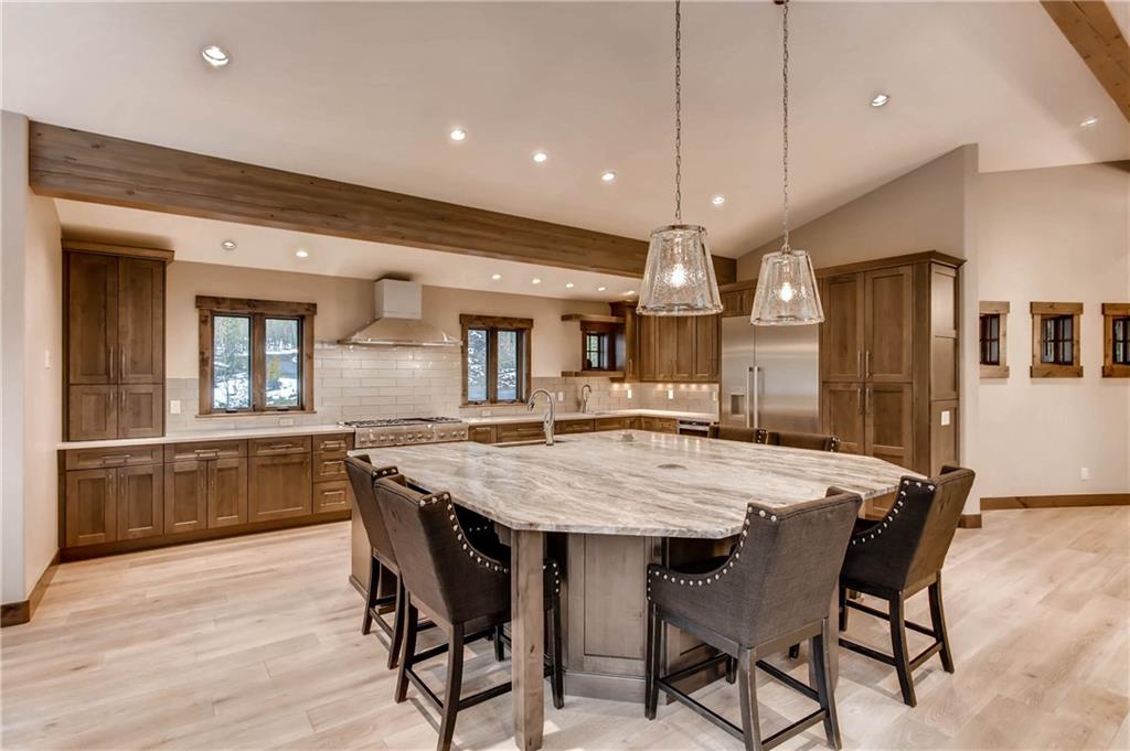 11 Independence Road Keystone, CO 80435 - Photo 13 of 24 a large kitchen with a table and chairs
