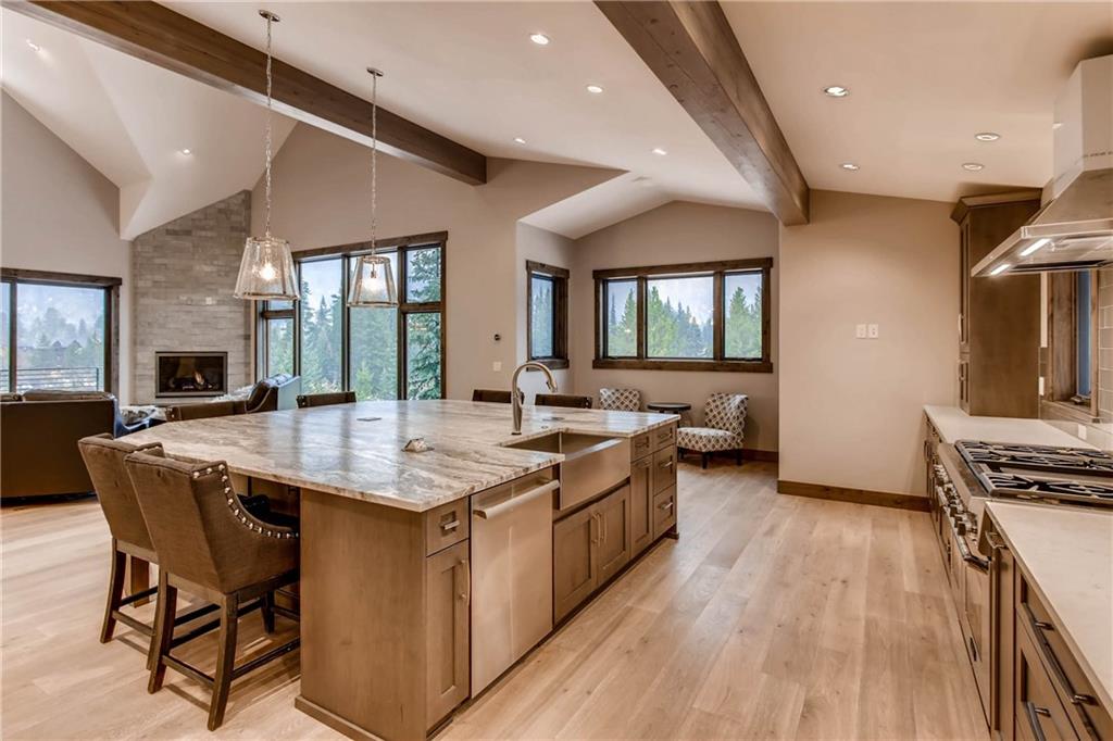 11 Independence Road Keystone, CO 80435 - Photo 4 of 24 a kitchen with stainless steel appliances granite countertop a stove and a wooden floors
