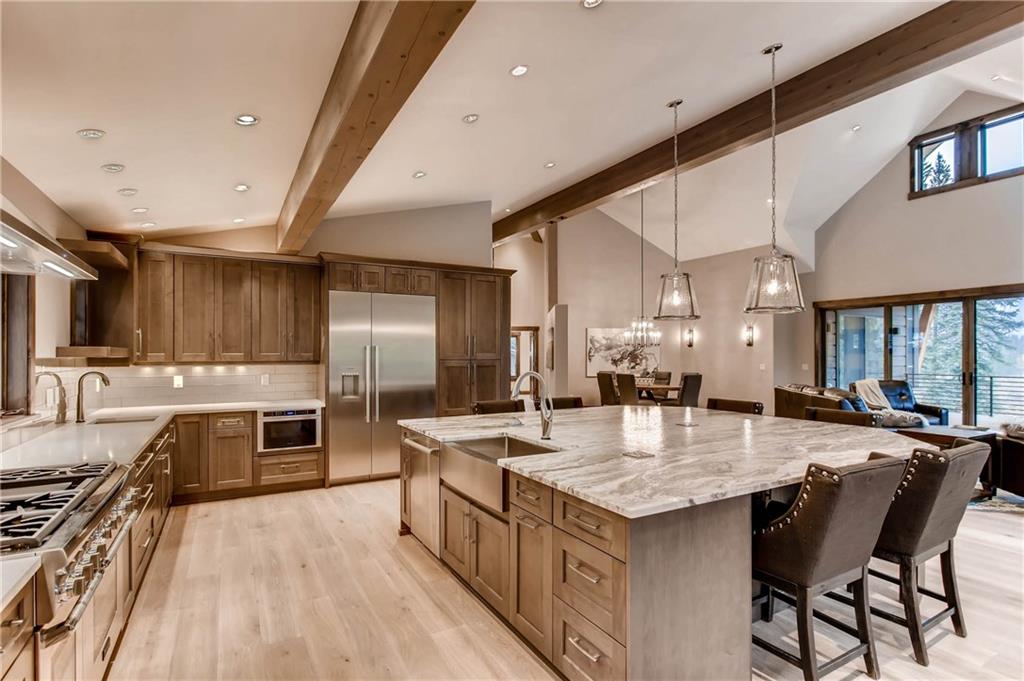 11 Independence Road Keystone, CO 80435 - Photo 7 of 24 a large kitchen with granite countertop a stove refrigerator and a sink