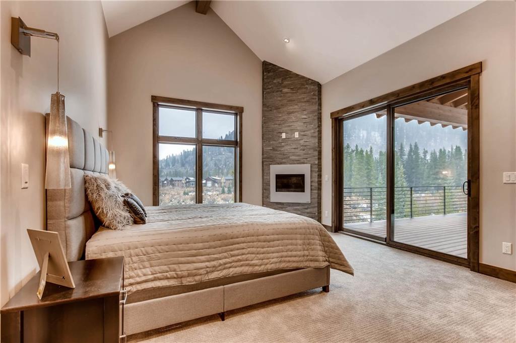 11 Independence Road Keystone, CO 80435 - Photo 10 of 24 a bedroom with a large bed and a balcony view