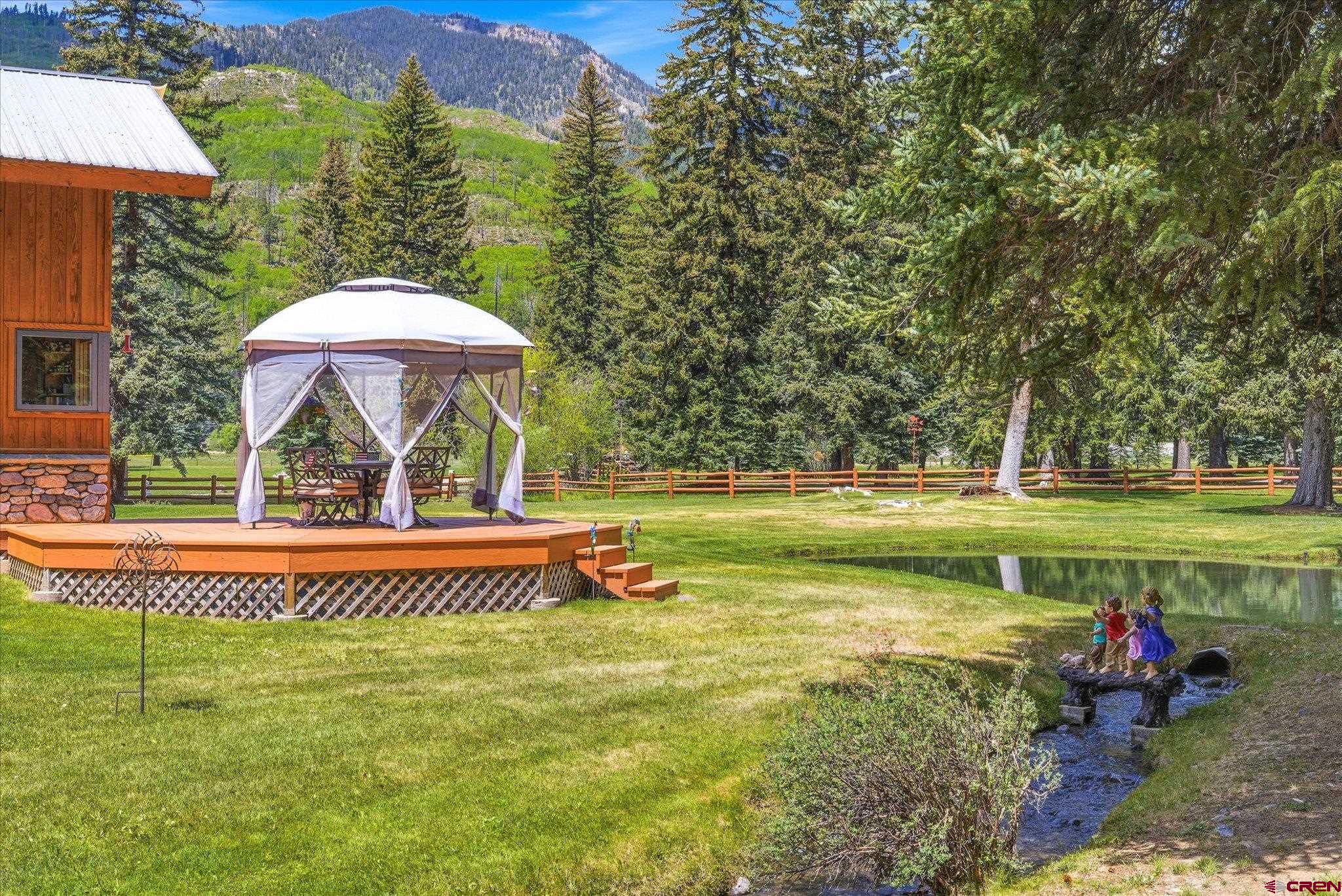 197 Hummingbird Way Bayfield, CO 81122 - Photo 6 of 44 a view of a swimming pool and lounge chair