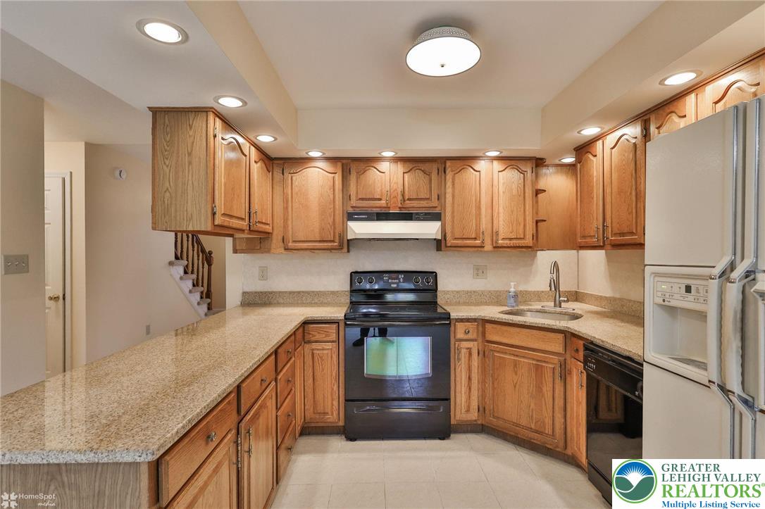 4059 Wedgewood Road Allentown, PA 18104 - Photo 20 of 50 a kitchen with a stove sink and refrigerator
