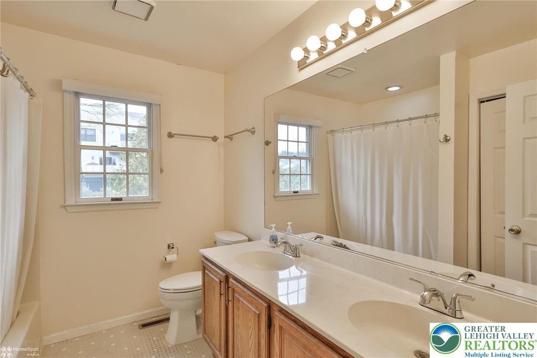 4059 Wedgewood Road Allentown, PA 18104 - Photo 37 of 50 a bathroom with a sink double vanity and a mirror