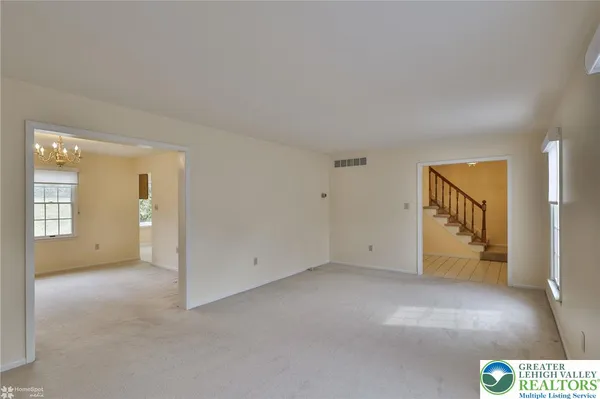 a view of an empty room with a window