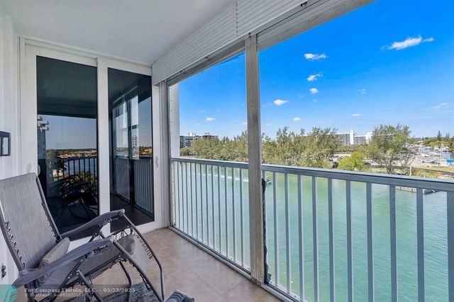 a view of balcony with furniture