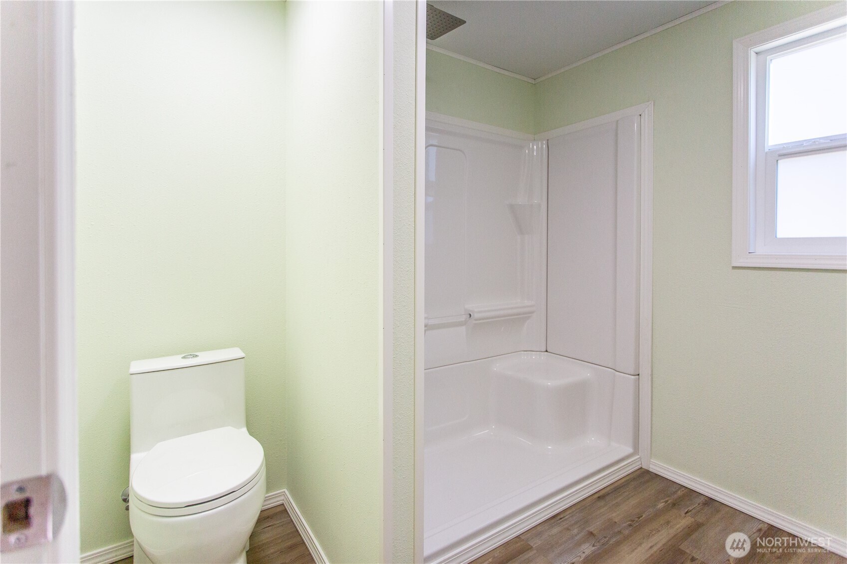17340 Sargent Road Southwest, Unit 35 Rochester, WA 98579 - Photo 11 of 25 a bathroom with a granite countertop toilet and a shower