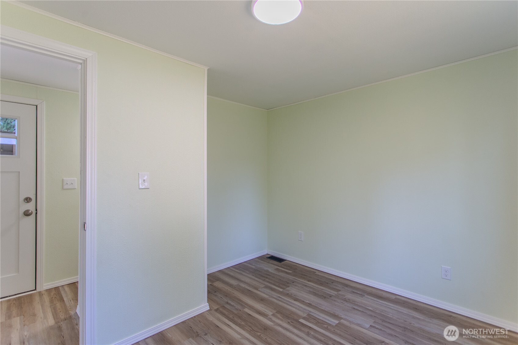 17340 Sargent Road Southwest, Unit 35 Rochester, WA 98579 - Photo 18 of 25 a view of an empty room and wooden floor