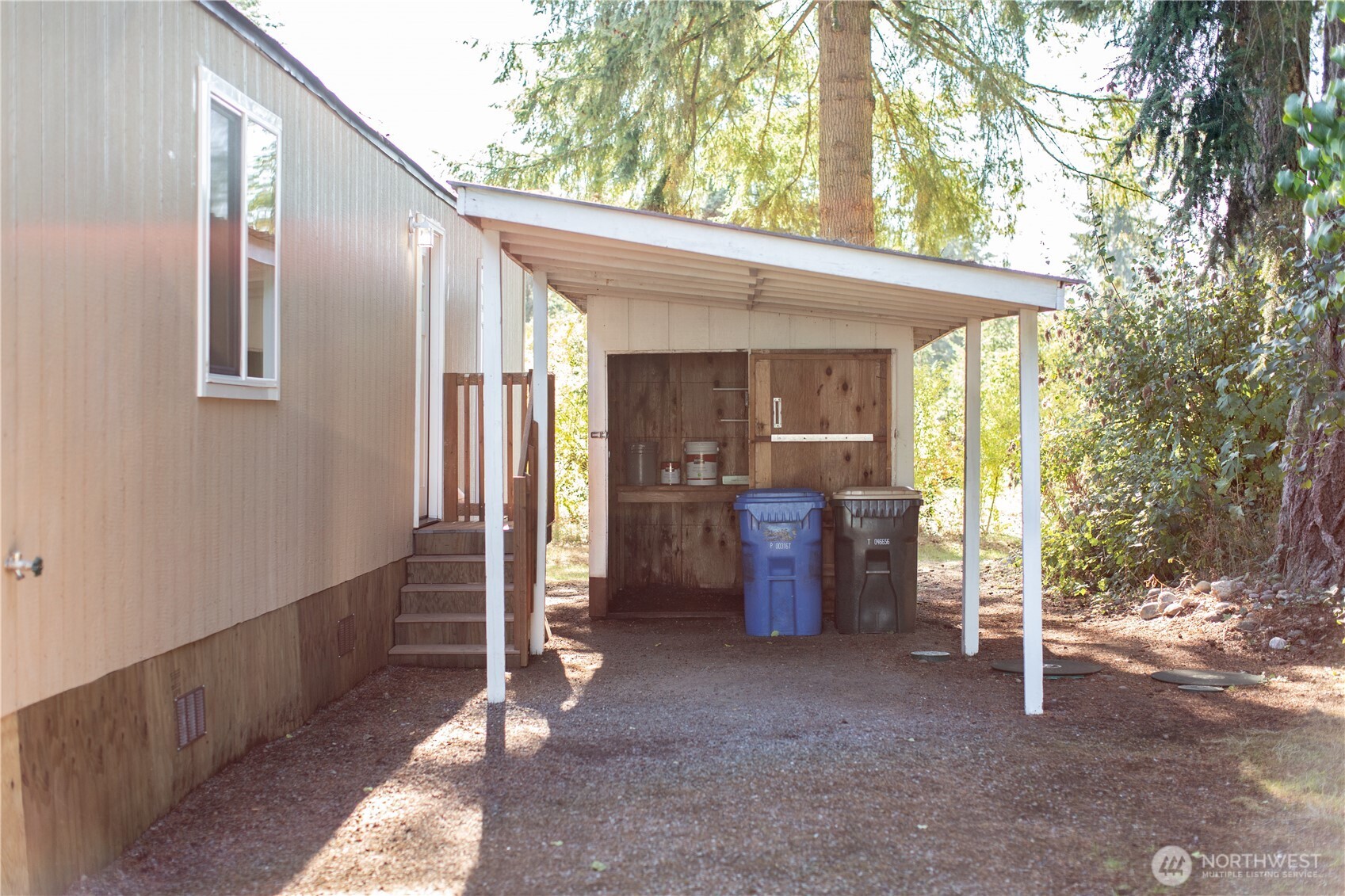 17340 Sargent Road Southwest, Unit 35 Rochester, WA 98579 - Photo 21 of 25 a view of a porch with furniture and a yard