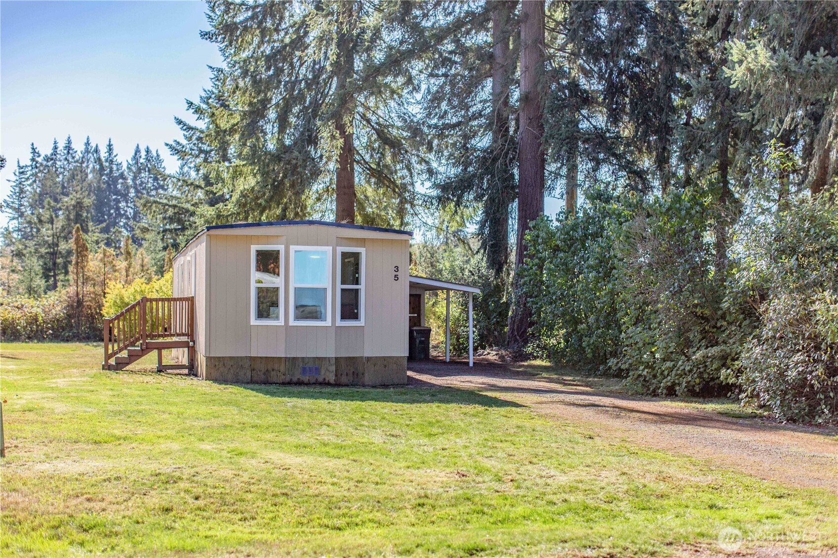 17340 Sargent Road Southwest, Unit 35 Rochester, WA 98579 - Photo 22 of 25 a view of a house with backyard and tree